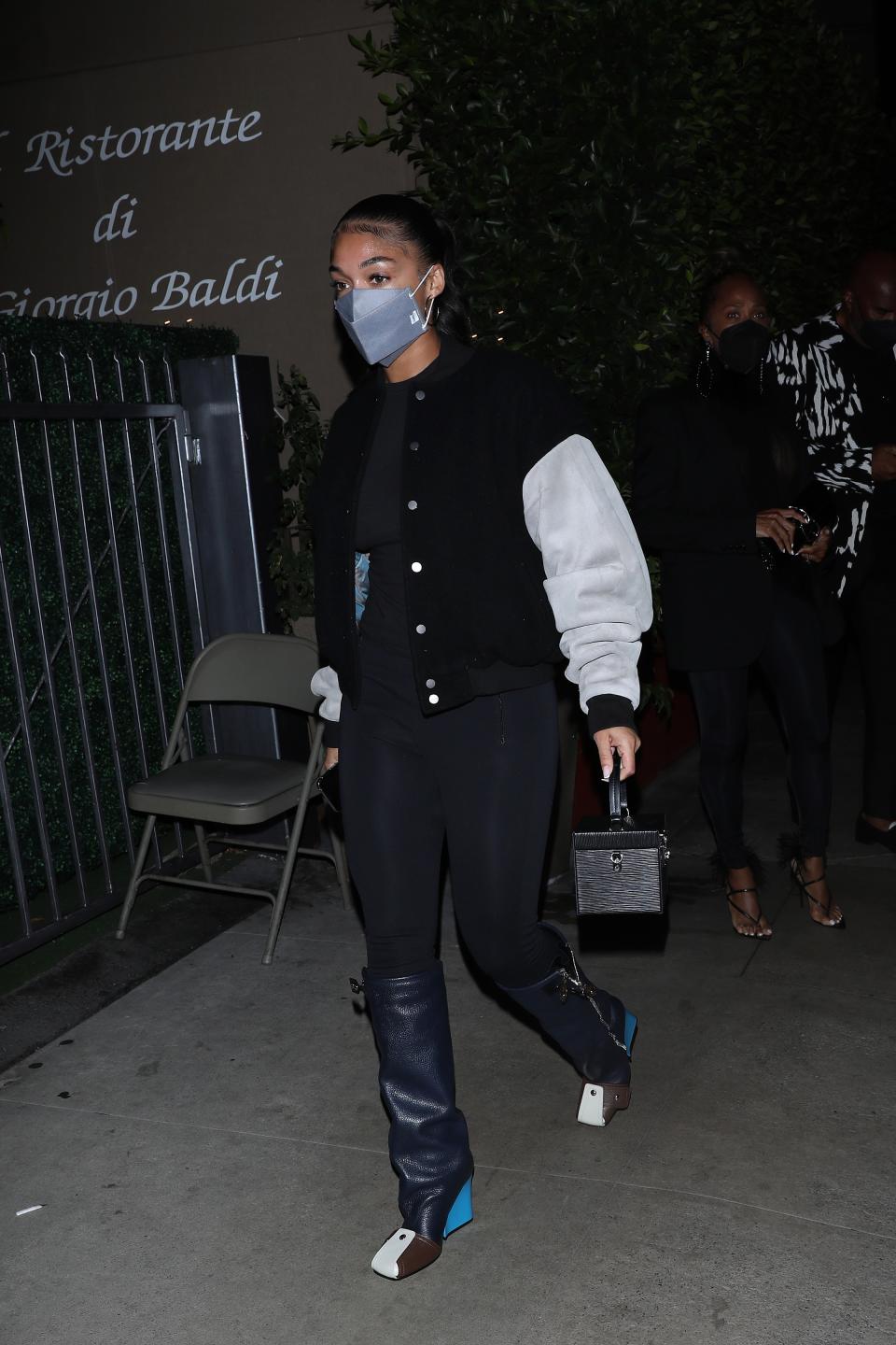 Lori Harvey wears Louis Vuitton boots on Sept. 3, 2021. - Credit: Photographer Group/MEGA