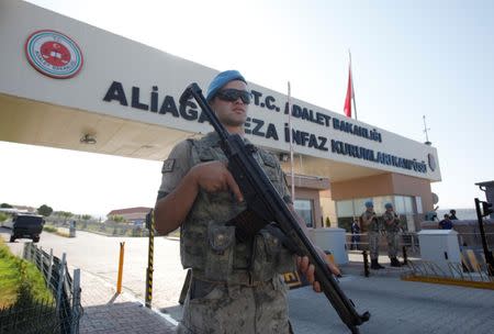 A Turkish soldier stands guard in front of the Aliaga Prison and Courthouse complex in Izmir, Turkey July 18, 2018. REUTERS/Kemal Aslan