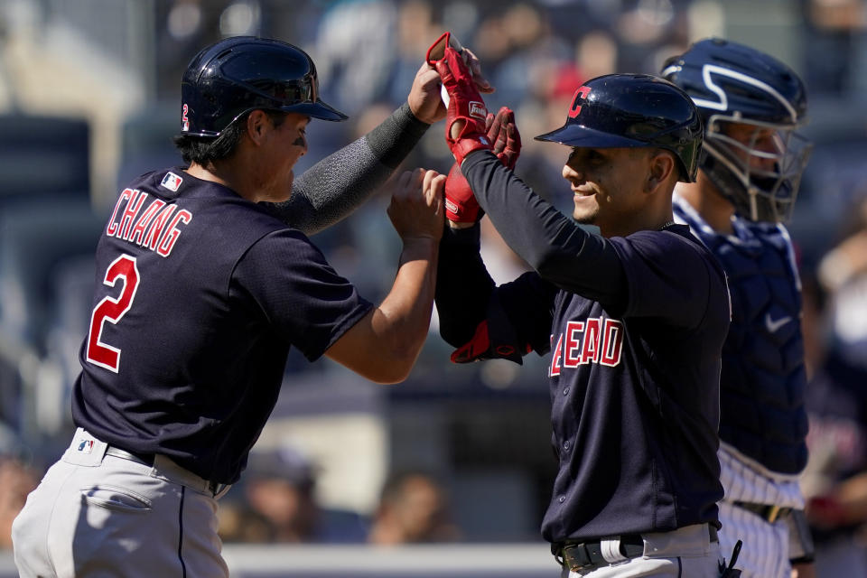 Cleveland Indians' Andres Gimenez, right, celebrates with Yu Chang, left, after hitting a three-run home run off New York Yankees relief pitcher Albert Abreu in the fifth inning of a baseball game, Saturday, Sept. 18, 2021, in New York. (AP Photo/John Minchillo)