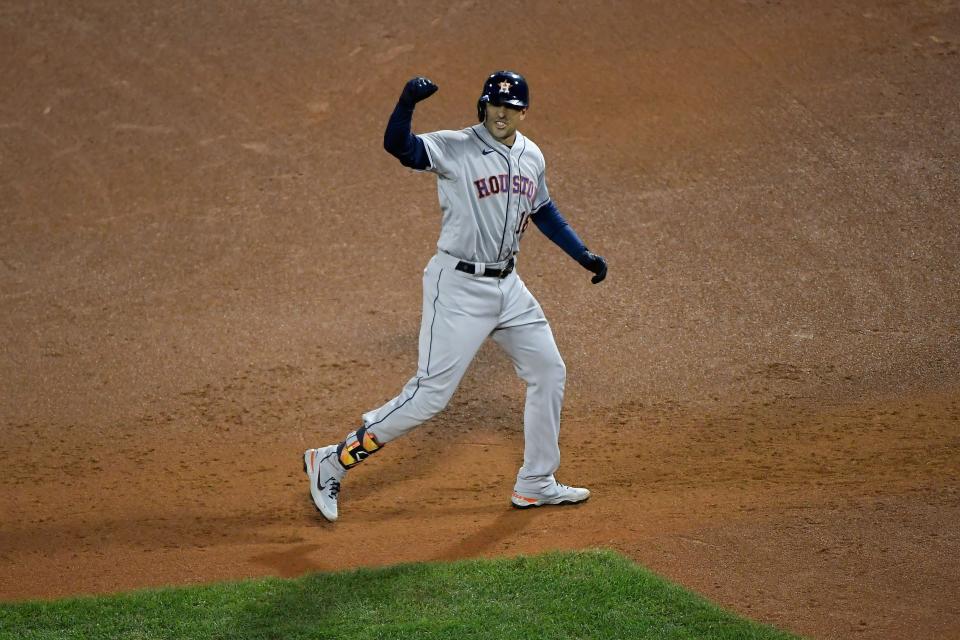 Houston Astros catcher Jason Castro (18) reacts after hitting an RBI single against the Boston Red Sox during the ninth inning of Game 4 of the ALCS.