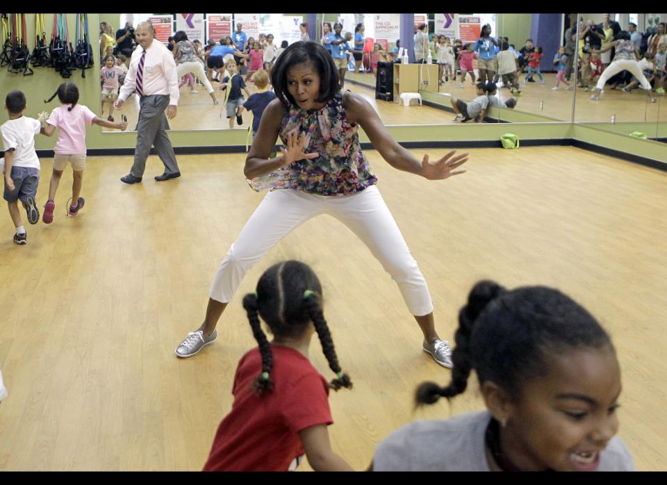 First lady Michelle Obama participates in games during a children's fitness class at the Blanchard Park YMCA, Tuesday, July 10, 2012, in Orlando, Fla.