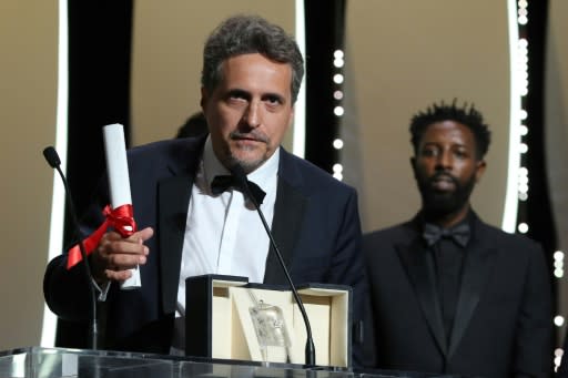 Brazilian film director Kleber Mendonca, pictured (left) at the 2019 Cannes Film Festival, managed to release "Bacurau" despite President Jair Bolsonaro's war on cinema