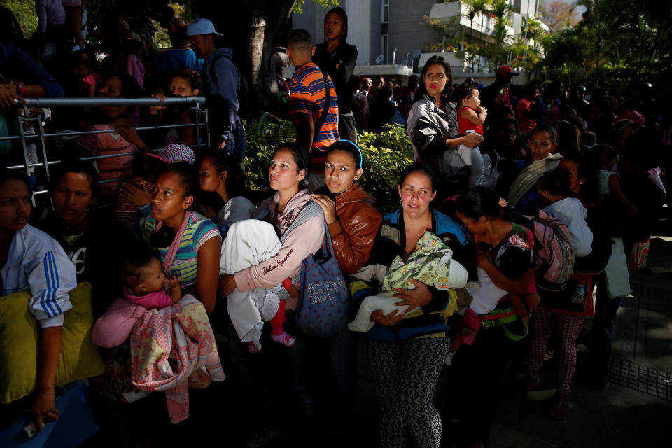 <p>MAR. 18, 2017 – Women carrying babies queue as they try to buy diapers outside a pharmacy in Caracas, Venezuela. Going into a fourth year of crippling recession, Venezuelaâs 30 million people found themselves skipping meals, suffering shortages of basic foods and medicines, jostling in lines for ever-scarcer subsidized goods, unable to keep up with dizzying inflation rates, and emigrating in ever larger numbers. (Photo: Carlos Garcia Rawlins/Reuters) </p>