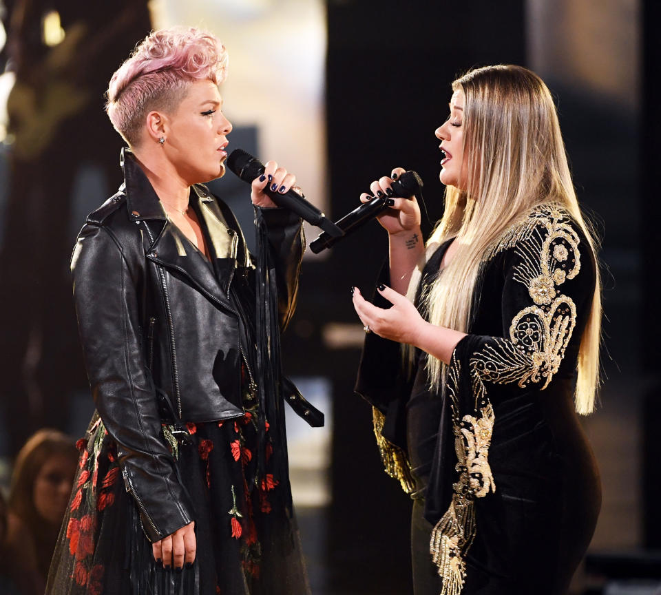 Kelly Clarkson and P!nk onstage during the 2017 American Music Awards at Microsoft Theater on Nov. 19 in Los Angeles. (Getty Images)