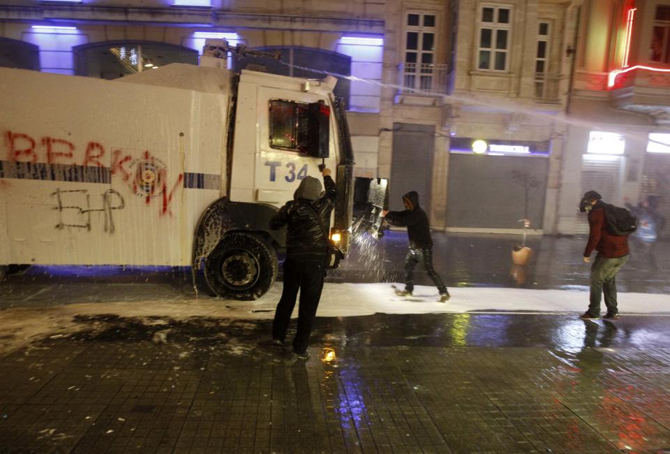 Riot police use water cannons to disperse demonstrators during a protest against internet censorship in Istanbul