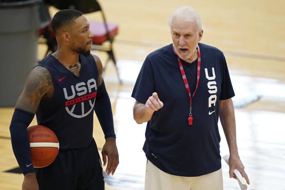 head coach Gregg Popovich, right, speaks with Damian Lillard during training for USA Basketball, Tuesday, July 6, 2021, in Las Vegas.