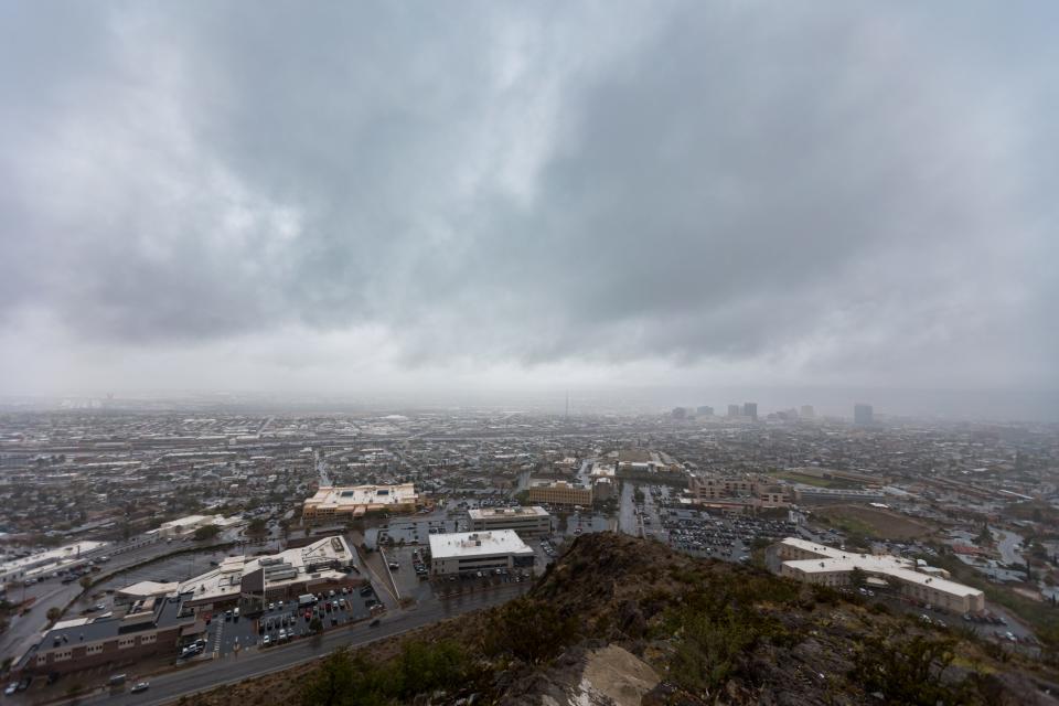 Rain clouds loom over El Paso on Wednesday. Rain fell across the Borderland for much of the day, bringing cool relief.