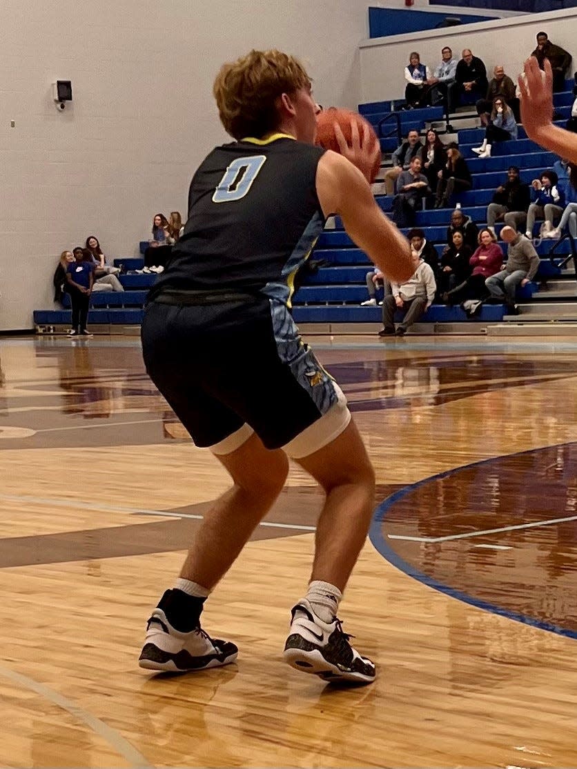 River Valley's Carson Smith looks to shoot a jump shot during a boys basketball game at Olentangy Berlin last week.