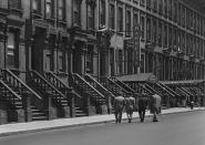 <p>Four men walk toward Barbetta’s, 46th Street, 1946. (© Todd Webb Archive) </p>