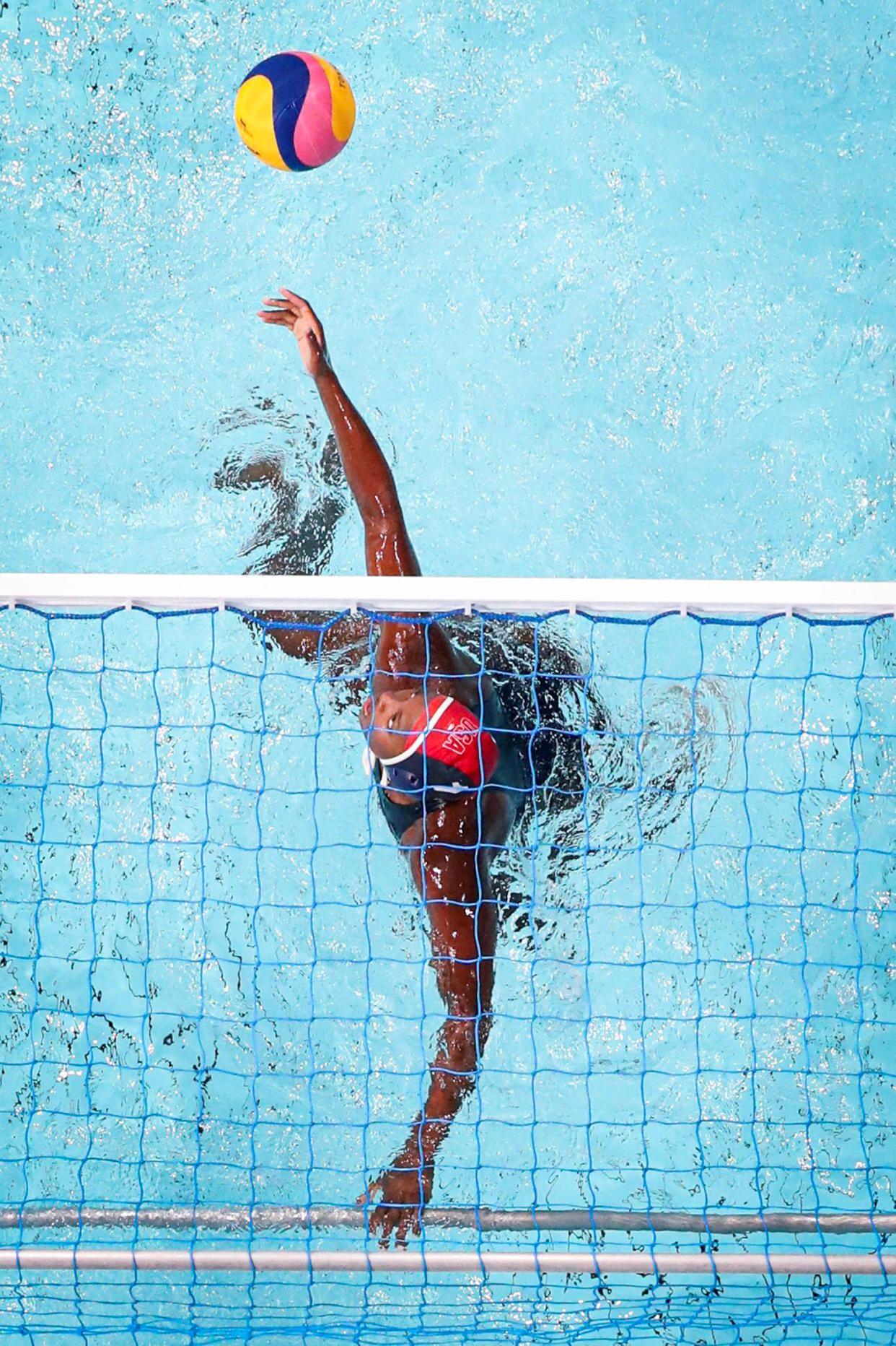 Ashleigh Johnson hits the ball. (Xia Yifang / Xinhua News Agency via Getty Images file)