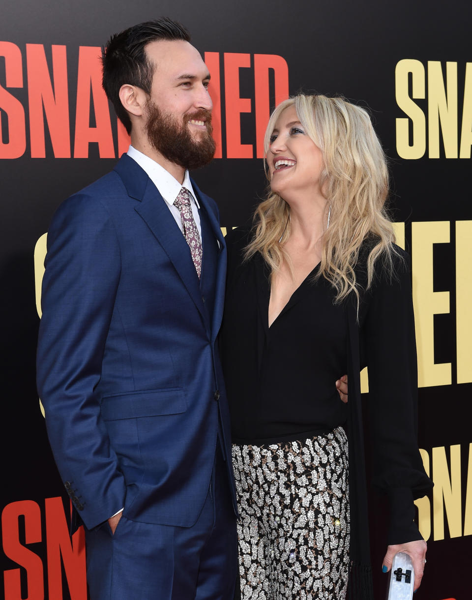 Kate Hudson, shown with boyfriend Danny Fujikawa, is expecting her third child and her first with him. (Photo: Getty Images)