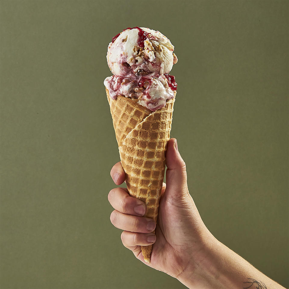 This image provided by Salt & Straw shows a cone filled with one of the company's most unique offerings – a Thanksgiving feast in ice cream form, with turkey bacon, buttery brittle and jammy cranberry sauce flavors folded into a creamy base. (Salt & Straw via AP)