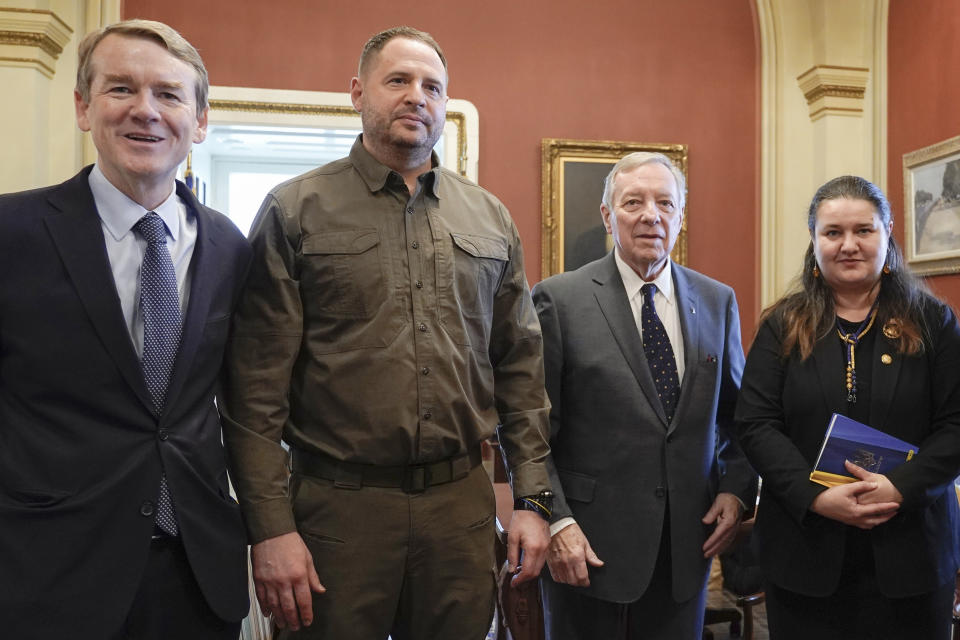 FILE - From the left Sen. Michael Bennet, D-Colo., Ukrainian Minister of Defense Rustem Umerov, Sen. Dick Durbin, D-Ill., and Ukrainian Ambassador to the United States Oksana Markarova, stand for a group photo before a meeting in Durbin's office, Wednesday, Dec. 6, 2023, at the Capitol in Washington. As the Senate wrapped up its work for the year, Bennet took to the floor of the nearly empty chamber and made a late-night plea for Congress to redouble support for Ukraine: “Understand the stakes at this moment." (AP Photo/Mariam Zuhaib, File)