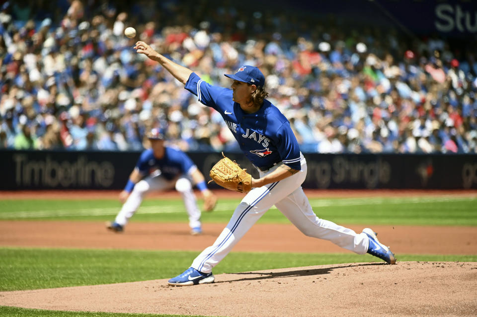 Toronto Blue Jays' starting pitcher Kevin Gausman throws to a Tampa Bay Rays batter during the first inning of a baseball game, Saturday, July 2, 2022 in Toronto. (Jon Blacker/The Canadian Press via AP)