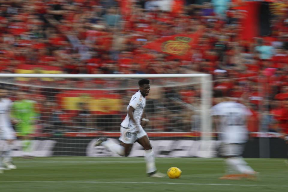 Real Madrid's Aurelien Tchouameni runs with the ball during a Spanish La Liga soccer match between Mallorca and Real Madrid at the Son Moix stadium in Palma de Mallorca, Spain, Saturday, April 13, 2024. (AP Photo/Francisco Ubilla)