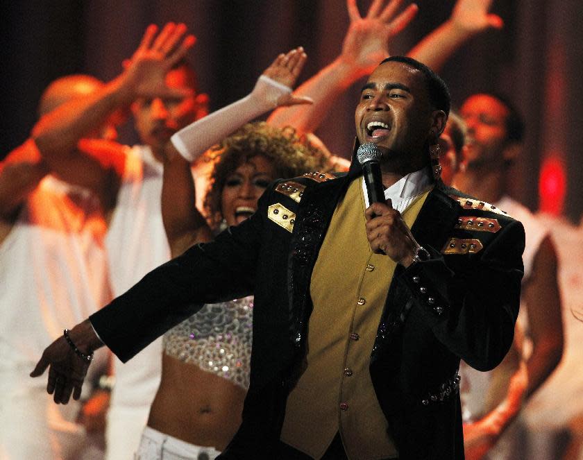 FILE - This April 26, 2012 file photo shows Don Omar performing during the Latin Billboard Awards in Coral Gables, Fla. Zumba Fitness instructors worldwide are not only using the Latin-heavy song lineup in their classes but creating new fans for artists such as Pitbull, Daddy Yankee and Don Omar, all of whom have recorded songs for Zumba. (AP Photo/Lynne Sladky, File)