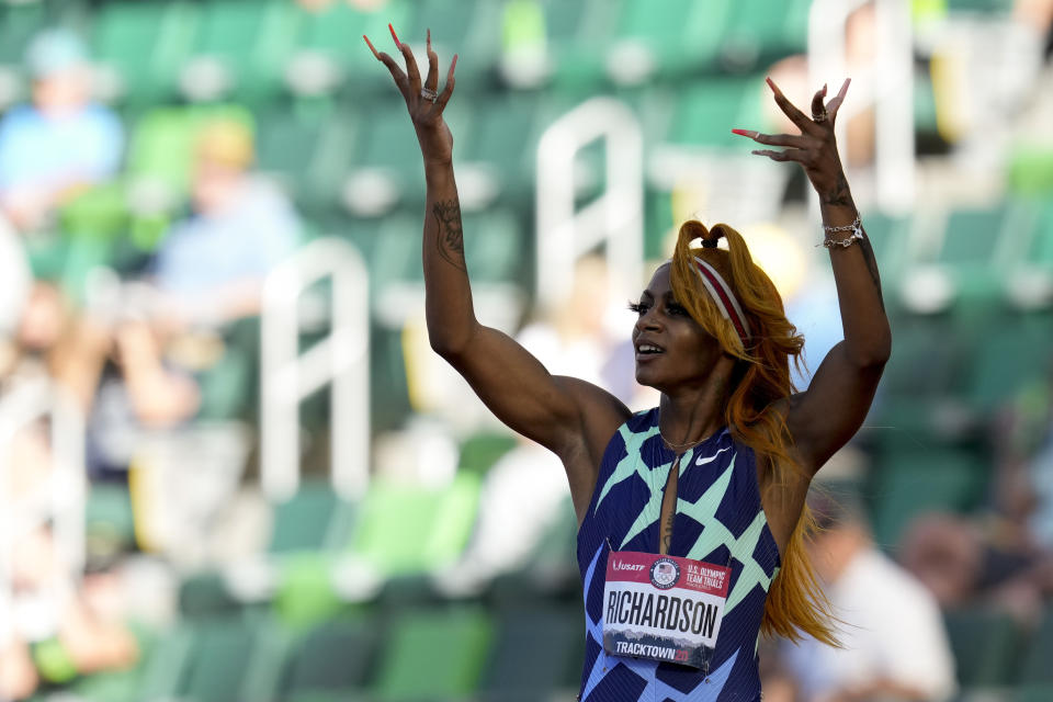 Sha'Carri Richardson celebrates after winning the first heat of the semi finals in women's 100-meter runat the U.S. Olympic Track and Field Trials Saturday, June 19, 2021, in Eugene, Ore. (AP Photo/Ashley Landis)