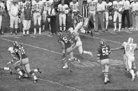 FILE - In this Jan. 15, 1973, file photo, Miami Dolphins' Nick Buoniconti (85) runs after intercepting a pass against the Washington Redskins at the Super Bowl in Los Angeles. The Dolphins won 24-7. Pro Football Hall of Fame middle linebacker Nick Buoniconti, an undersized overachiever who helped lead the Miami Dolphins to the NFL's only perfect season, has died at the age of 78. Bruce Bobbins, a spokesman for the Buoniconti family, said he died Tuesday, July 30, 2019, in Bridgehampton, N.Y. (AP Photo/File)
