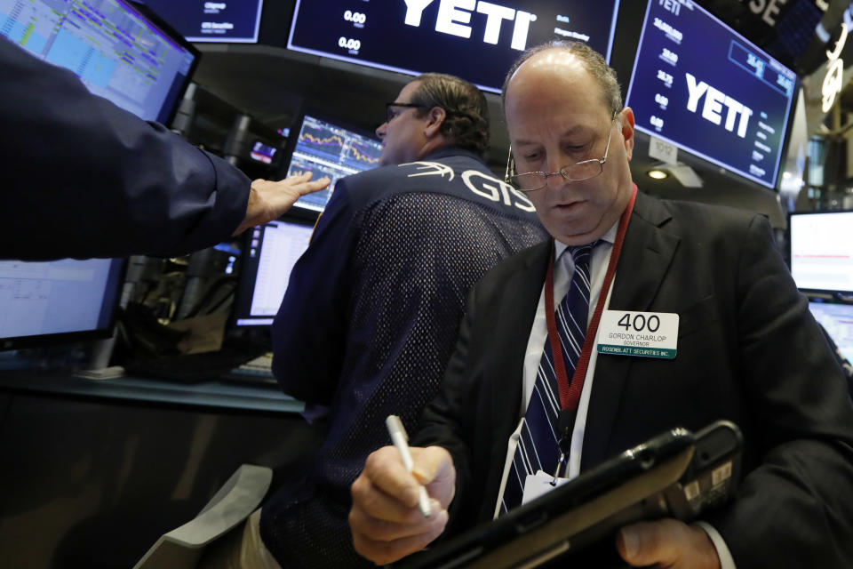 Trader Gordon Charlop works on the floor of the New York Stock Exchange, Friday, Oct. 26, 2018. Stocks are opening broadly lower on Wall Street, a day after a massive surge, as a number of big companies reported disappointing results. (AP Photo/Richard Drew)