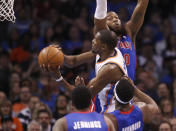 Oklahoma City Thunder forward Kevin Durant (35) goes up for a shot in front of Detroit Pistons guard Brandon Jennings, front, center Andre Drummond and forward Greg Monroe (10) during the first quarter of an NBA basketball game in Oklahoma City, Wednesday, April 16, 2014. (AP Photo/Sue Ogrocki)