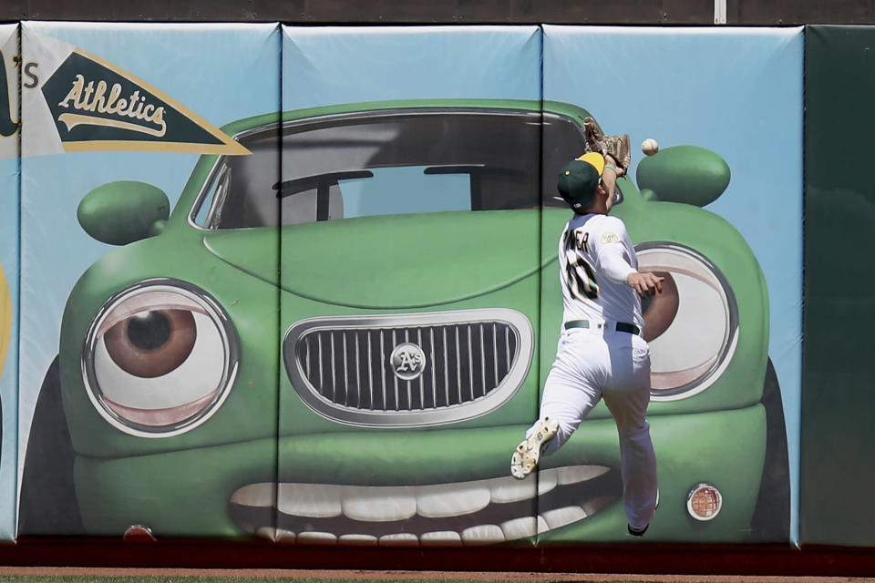 Oakland Athletics' Chad Pinder (10) can't catch up to a Minnesota Twins' Luis Arraez double in the fourth inning of a baseball game in Oakland, Calif., on Wednesday, May 18, 2022. (AP Photo/Scot Tucker)