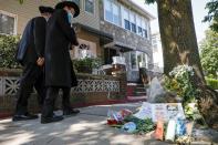 A makeshift memorial for recently passed Associate Justice of the Supreme Court of the United States Ruth Bader Ginsburg is seen outside her childhood home in Brooklyn, New York