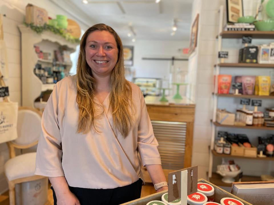 Sarah Prasser stands inside Cedarburg's Frannie's Market, where she sells food and wine options, many with local and regional connections. She also added a new dinner series with wine pairings at Abloom Farm of Saukville. The first three dinners sold out within 24 hours. She will be adding new dates soon.