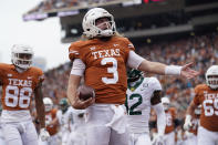 Texas quarterback Quinn Ewers (3) celebrates after scoring a touchdown against Baylor during the first half of an NCAA college football game in Austin, Texas, Friday, Nov. 25, 2022. (AP Photo/Eric Gay)