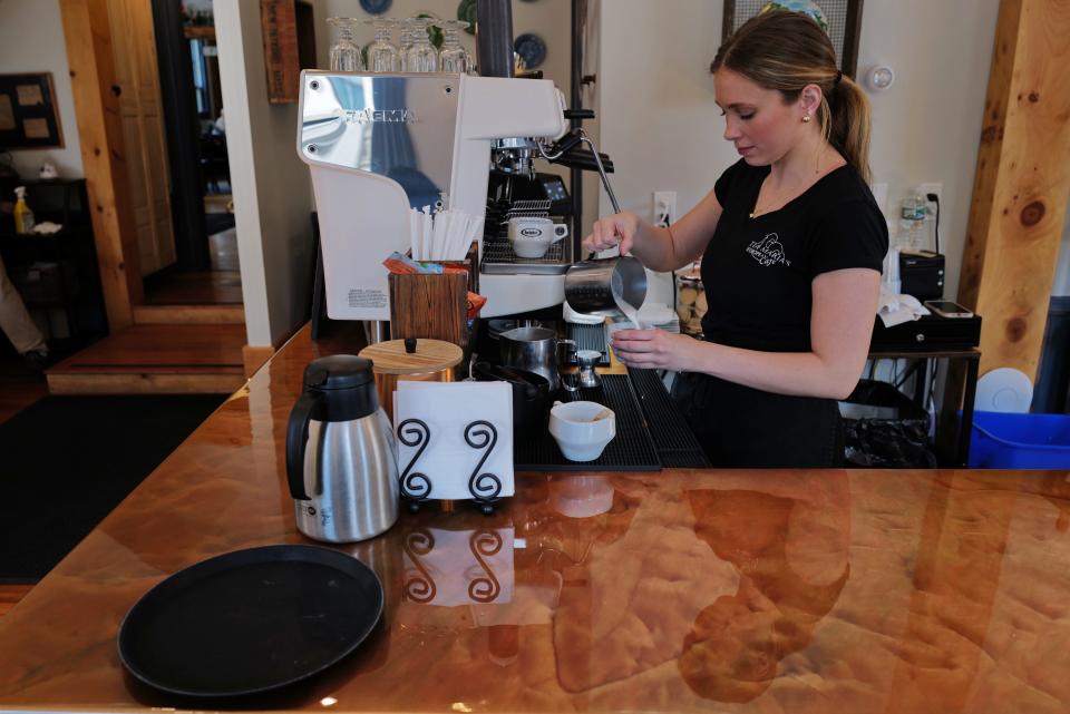 Olivia Vital prepares a cappuccino for a customer at Tia Maria's European Cafe in New Bedford. Vital, who recently graduated from UMass Dartmouth with a marketing degree, is working with the owner on weekly content across multiple social media platforms to promote the downtown restaurant.