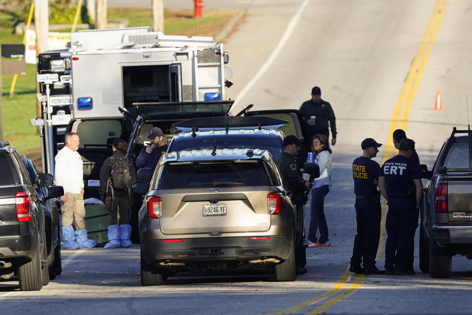 FILE - Police maintain their presence at Schemengees Bar and Grille in the aftermath of a mass shooting in Lewiston, Maine, Saturday, Oct. 28, 2023. Despite warnings of deteriorating mental health, drunken threats and guns, the sheriff department chose to avoid confronting an Army reservist who later killed 18 people and work with family and the Army to get him help, states the report, released late Thursday, Dec. 14, 2023. (AP Photo/Matt Rourke, File)