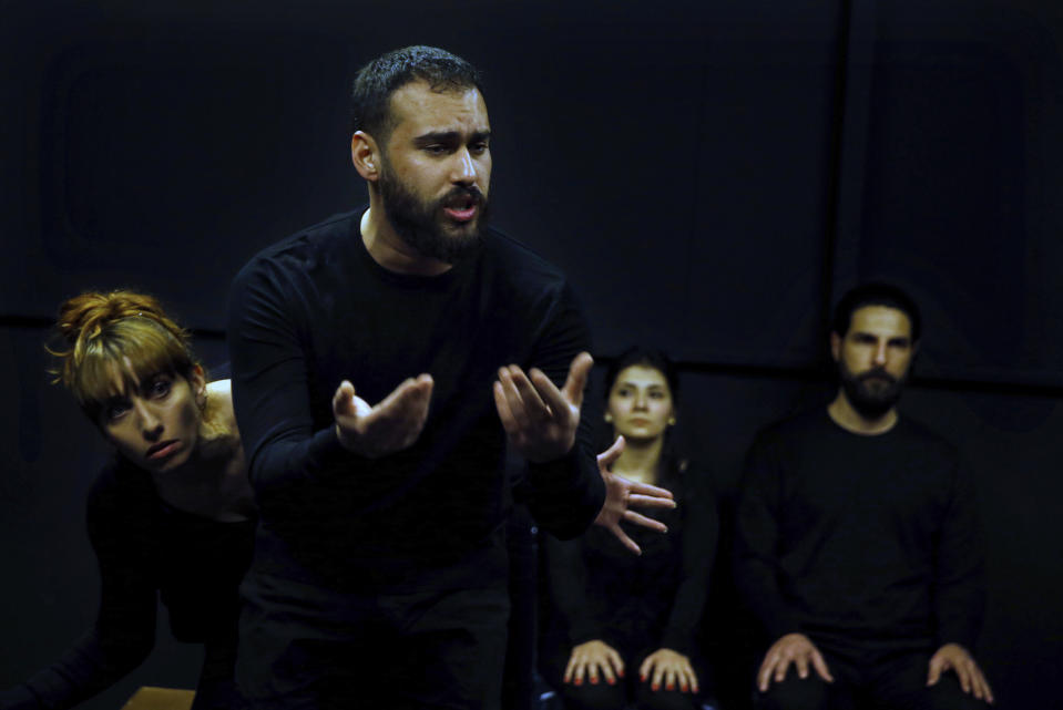 In this Friday, Feb. 8, 2019 photo, Syrian actor Hassan takes part in a playback theater at the end of a three-month training session, in Beirut, Lebanon. Syrians from different parts of their war-torn country have gathered inside a theater telling their stories that are later re-acted by a group of Syrians who have been training on playback theater. (AP Photo/Bilal Hussein)