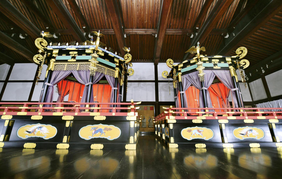 This April 17, 2018, photo shows Takamikura throne, left, and Michodai, a curtained platform, placed at the Kyoto Imperial Palace in Kyoto, western Japan. The special imperial throne for the coronation of Japan’s new emperor arrived in Tokyo on Wednesday, Sept. 26, 2018, from the ancient imperial palace in Kyoto more than a year ahead of time. The Takamikura throne will be used at a ceremony in October 2019 when Crown Prince Naruhito formally announces his succession. (Kyodo News via AP)