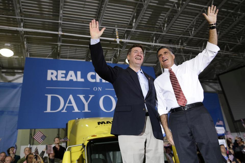 Republican presidential candidate, former Massachusetts Gov. Mitt Romney and Virginia Republican Senate candidate George Allen wave to supporters during a campaign at Integrity Windows in Roanoke, Va., Thursday, Nov. 1, 2012. (AP Photo/Charles Dharapak)