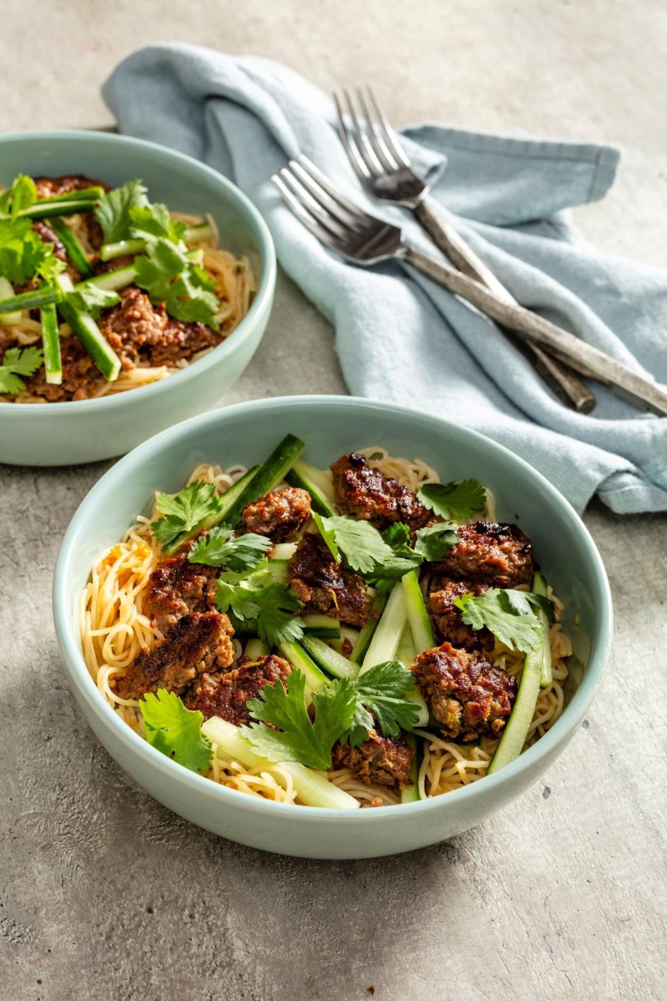 Rice Noodle Bowl with Scallion-Meat Patties and Cucumber has plant-based ground meat as part of the mix.