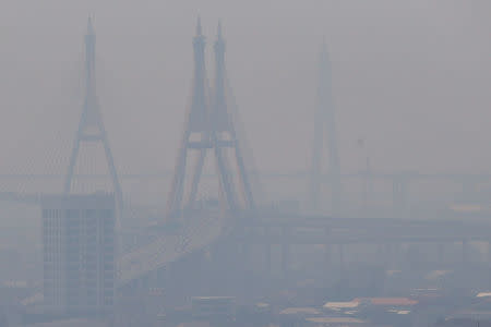 The Bhumibol bridge is seen through air pollution in Bangkok, Thailand February 15, 2018. REUTERS/Athit Perawongmetha