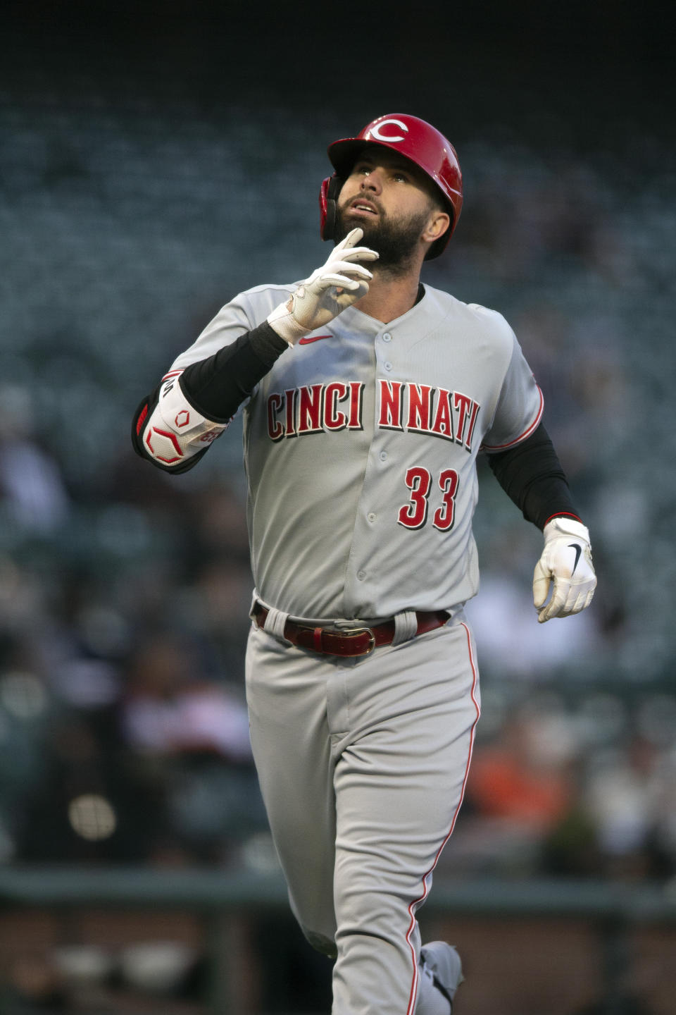 Cincinnati Reds' Jesse Winker points skyward as he runs out his two-run home run against the San Francisco Giants during the third inning of a baseball game, Monday, April 12, 2021, in San Francisco, Calif. (AP Photo/D. Ross Cameron)