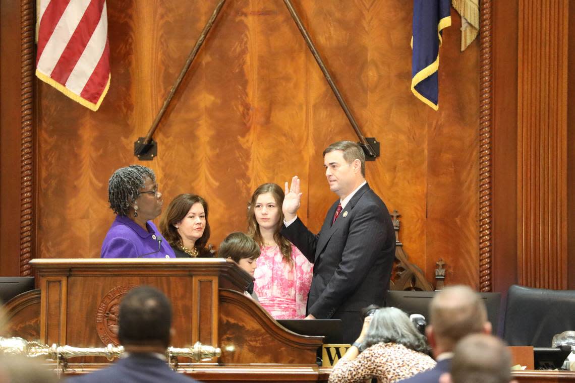 South Carolina Republican House Speaker Murrell Smith, right, takes his oath of officer from Democratic Rep. Gilda Cobb-Hunter of Orangeburg on Tuesday, Dec. 6, 2022, in the House chambers in Columbia, South Carolina. (AP Photo/Jeffrey Collins)
