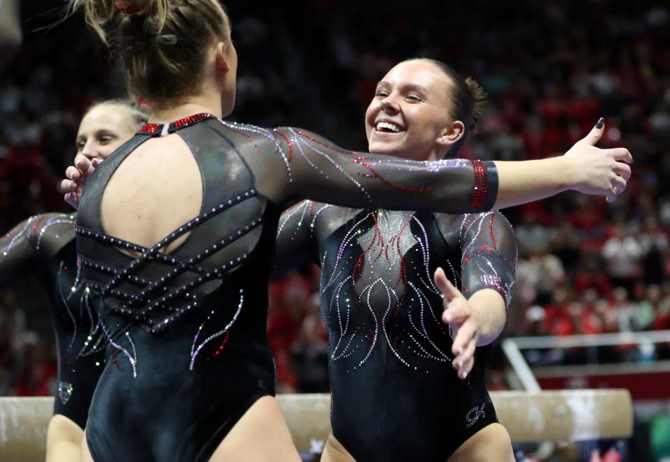 Utah’s Maile O’Keefe gets a hug after finishing a 10.0 beam routine as the Utah Red Rocks compete against Oregon State in a gymnastics meet at the Huntsman Center in Salt Lake City on Friday, Feb. 2, 2024. Utah won. | Kristin Murphy, Deseret News