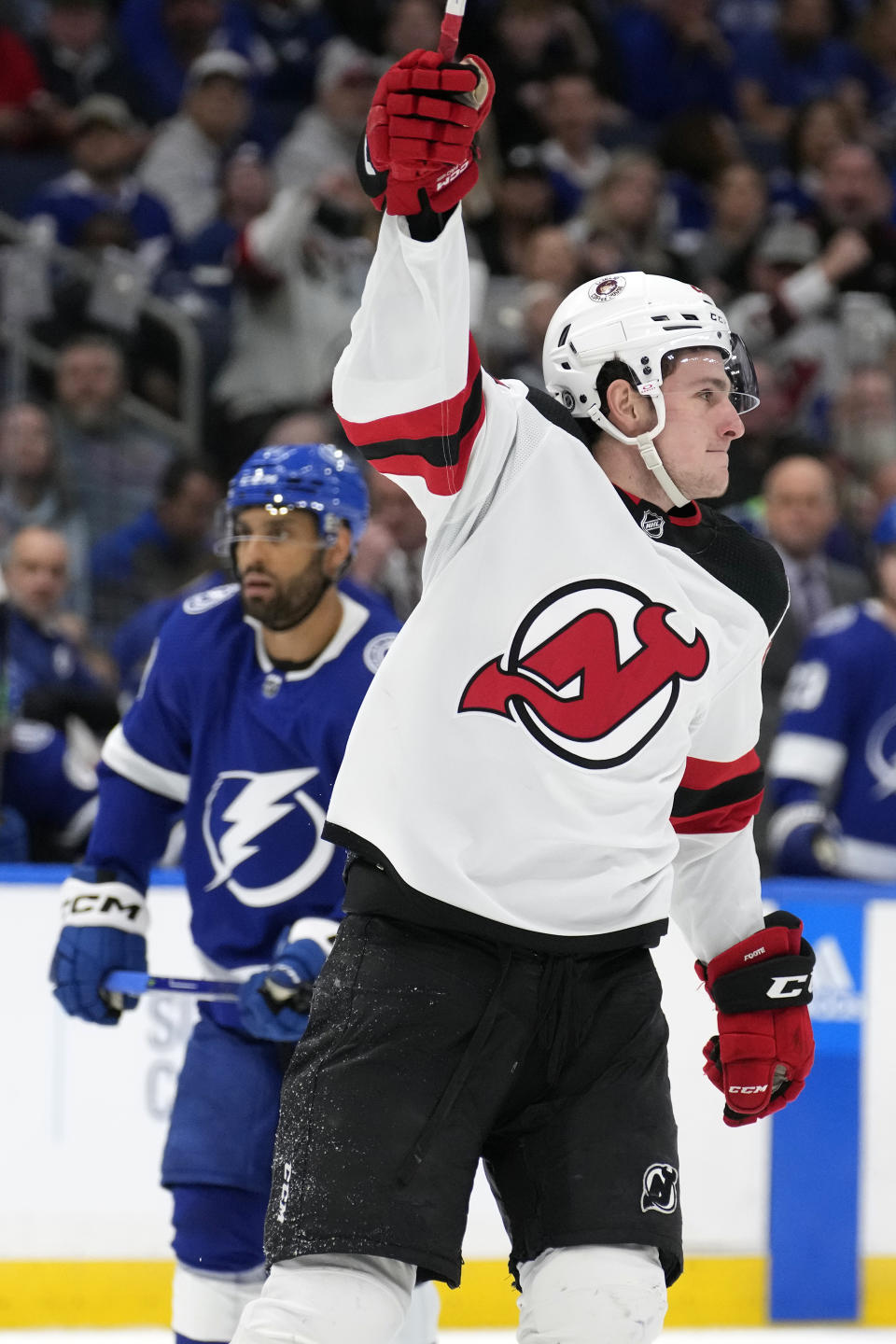 New Jersey Devils left wing Nolan Foote (25) celebrates after scoring against the Tampa Bay Lightning during the.third period of an NHL hockey game Sunday, March 19, 2023, in Tampa, Fla. (AP Photo/Chris O'Meara)