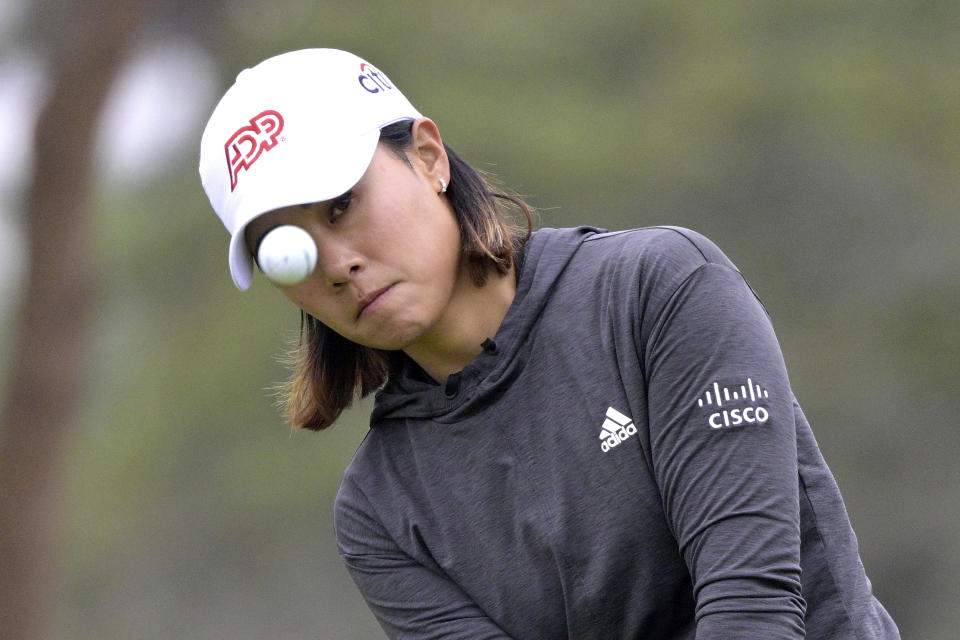 Danielle Kang chips onto the eighth green during the final round of the Tournament of Champions LPGA golf tournament, Sunday, Jan. 23, 2022, in Orlando, Fla. (AP Photo/Phelan M. Ebenhack)