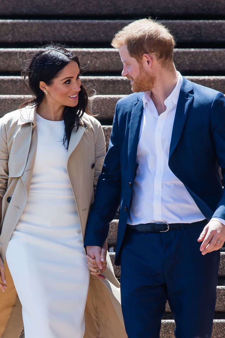 <p>Meghan's dress is by Australian designer <a rel="nofollow noopener" href="https://www.harpersbazaar.com/fashion/designers/a23810788/meghan-markles-karen-gee-dress/" target="_blank" data-ylk="slk:Karen Gee;elm:context_link;itc:0;sec:content-canvas" class="link ">Karen Gee</a>.</p>