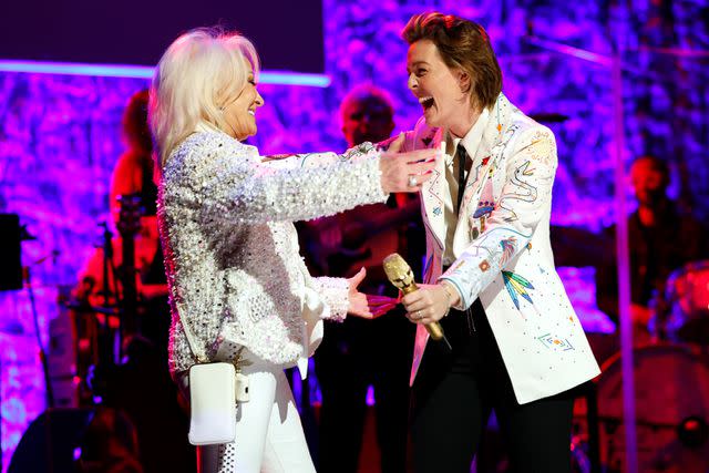 <p>Jason Kempin/Getty</p> Tanya Tucker joins Brandi Carlile onstage during the Class of 2023 Medallion Ceremony at Country Music Hall of Fame and Museum on Oct. 22, 2023 in Nashville