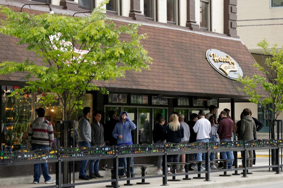 Customers line up outside Harry's Chocolate Shop May 11 in West Lafayette, Ind. The mayor says the shop didn't adequately prepare for large crowds when it reopened.