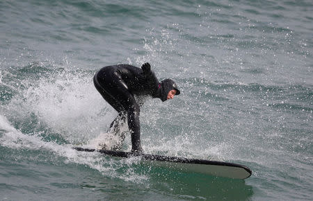 Australian Olympic team member Rohan Chapman-Davies surfs a wave in Gangneung, South Korea, February 24, 2018. REUTERS/Kim Hong-Ji