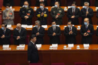 Delegates applaud as Chinese President Xi Jinping arrives for the opening session of China's National People's Congress (NPC) at the Great Hall of the People in Beijing, Friday, March 5, 2021. (AP Photo/Andy Wong)