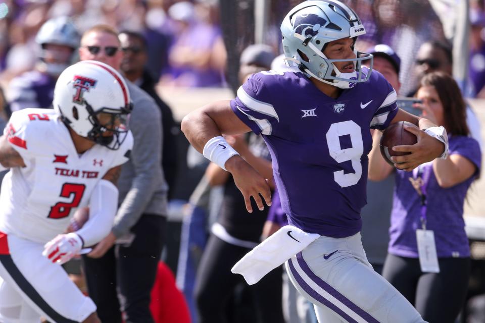 Oct 1, 2022; Manhattan, Kansas, USA; Kansas State Wildcats quarterback Adrian Martinez (9) is forced out of bounds by Texas Tech Red Raiders defensive back Reggie Pearson Jr. (2) during the second quarter at Bill Snyder Family Football Stadium. Mandatory Credit: Scott Sewell-USA TODAY Sports