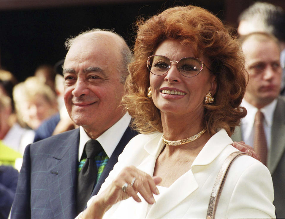 FILE - Italian actress Sophia Loren, right, with Mohamed Al Fayed outside Al Fayed's Harrods store in Knightsbridge, London, on July 7, 1999. Al Fayed, the former Harrods owner whose son Dodi was killed in a car crash with Princess Diana, has died at age 94. His death was announced Friday, Sept. 1, 2023, by Fulham Football Club, which Al Fayed once owned. (Stefan Rousseau/PA via AP)