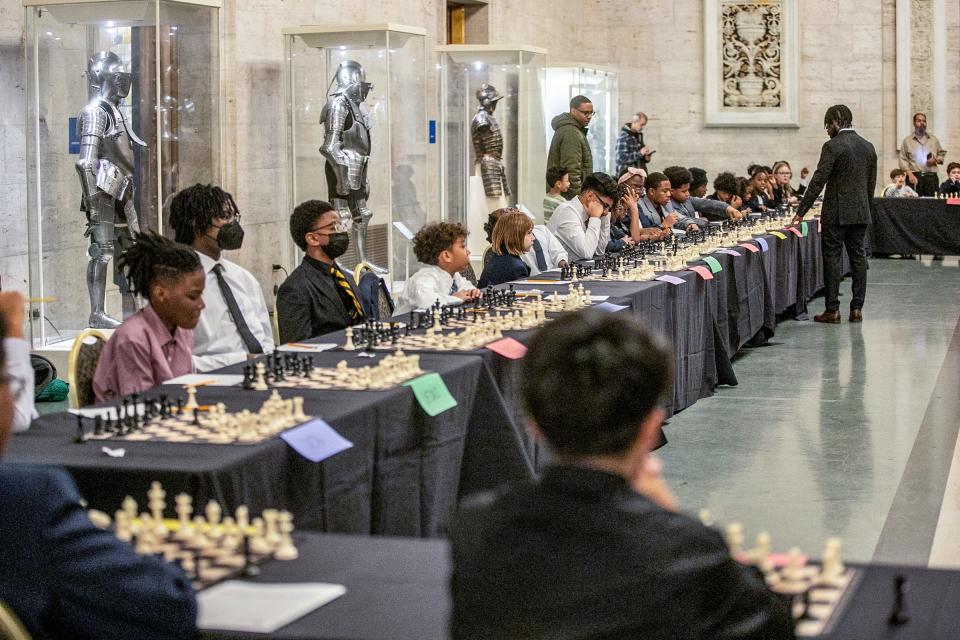 International Master Justus Williams plays chess simultaneously against selected members of the Detroit City Chess Club in the Great Hall at the Detroit Institute of Arts in Detroit on Friday, Dec. 8, 2023.