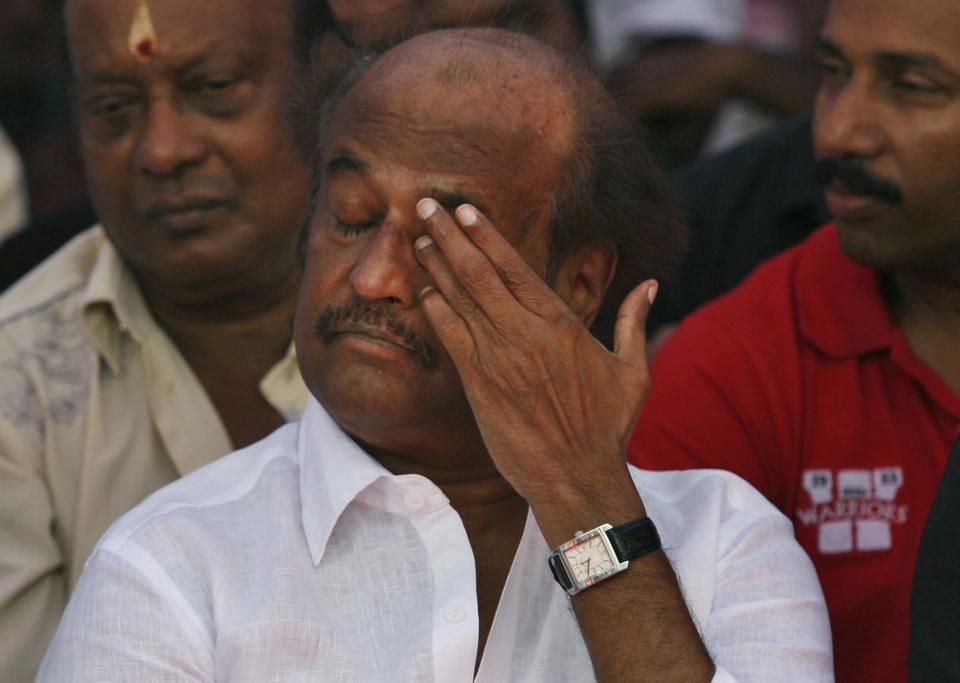 Indian Tamil superstar Rajnikanth gestures as he sits with other Tamil movie stars during a day long fast in Chennai, India, Tuesday, April 2, 2013, demanding probe into alleged wartime abuses by Sri Lanka. The stars are fasting for a day to protest what they say is the mistreatment of ethnic Tamils in neighboring Sri Lanka and to demand an international probe into alleged wartime abuses there. A U.N. investigation into the final months of the war indicated that the ethnic Sinhalese-dominated government might have killed as many as 40,000 Tamil civilians. (AP Photo/Arun Sankar K)