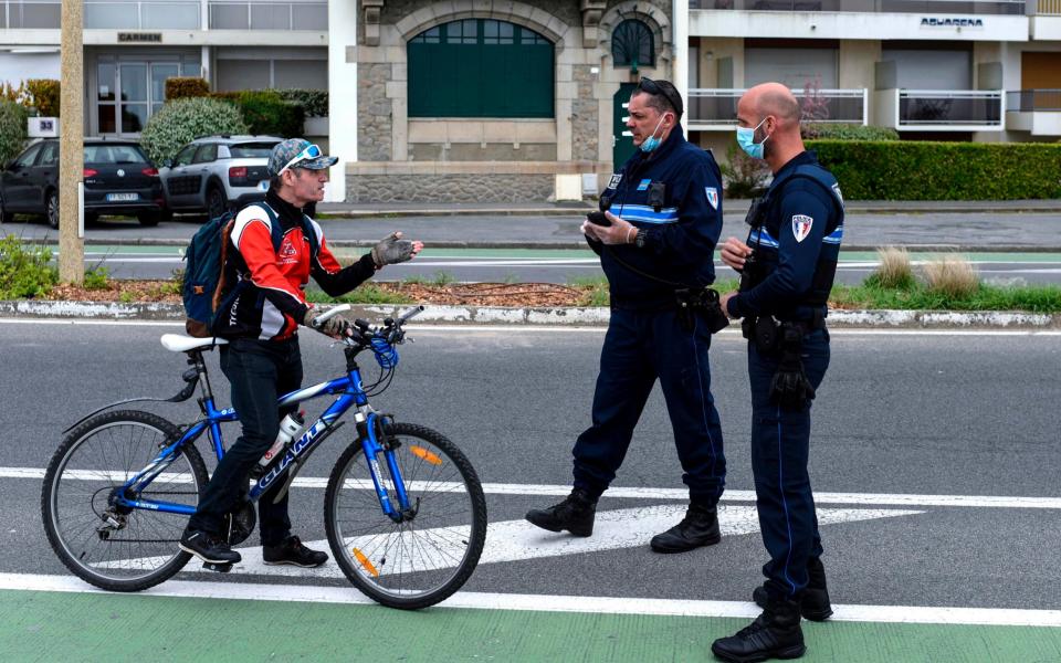 Mr Macron said the lockdown measures would have to continue. French people are only permitted to leave the house for essential trips - SEBASTIEN SALOM-GOMIS/AFP via Getty Images